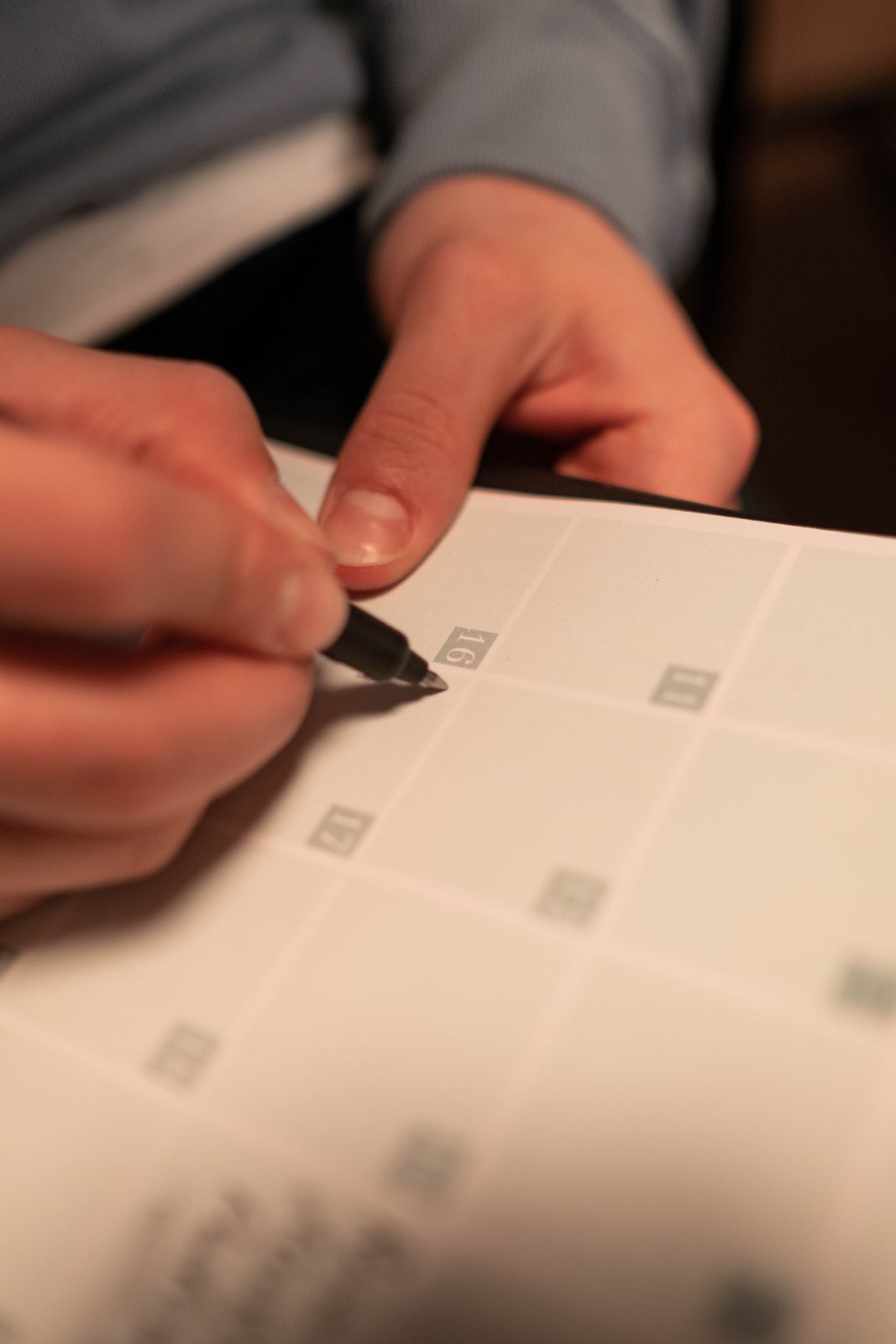 A pen resting on a calendar